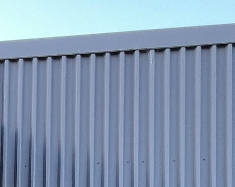 Trapezoidal profiled metal cladding